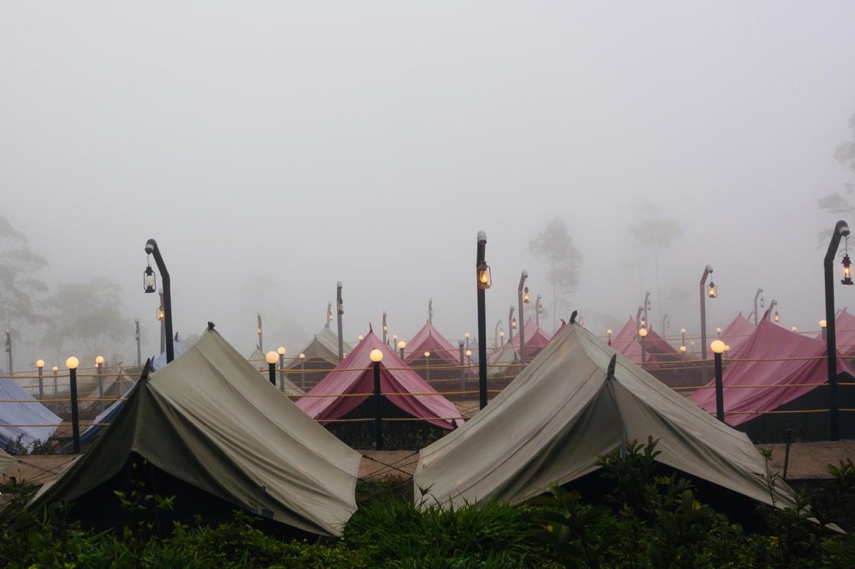 Alpine tents in the mist at the Kolukkumalai campsite