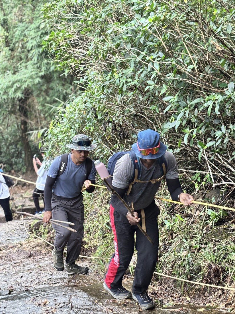 Trekkers on a steep section of the climb